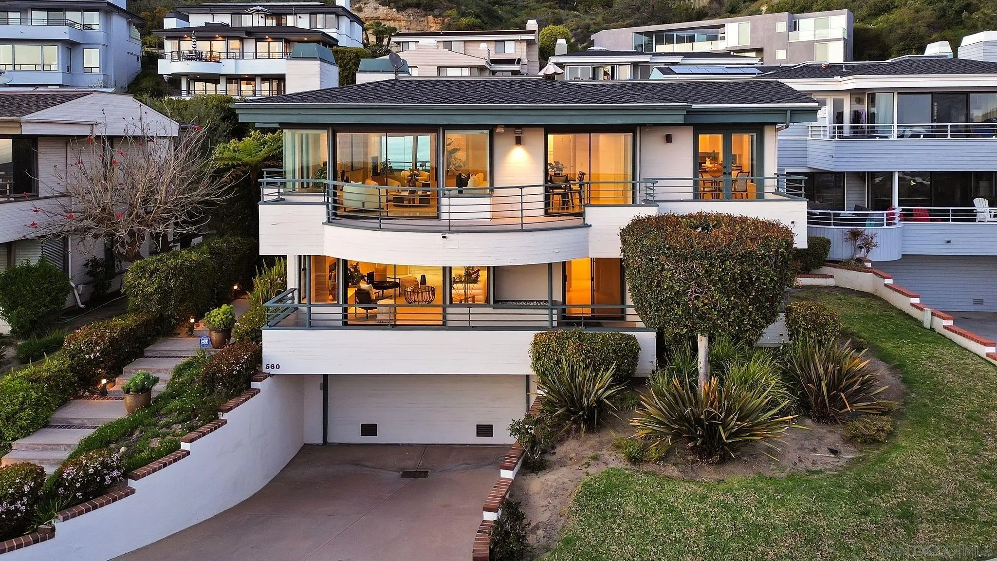 560 Torrey Point Road Del Mar, CA 92014 - Photo 33 of 35 a front view of a building with outdoor seating