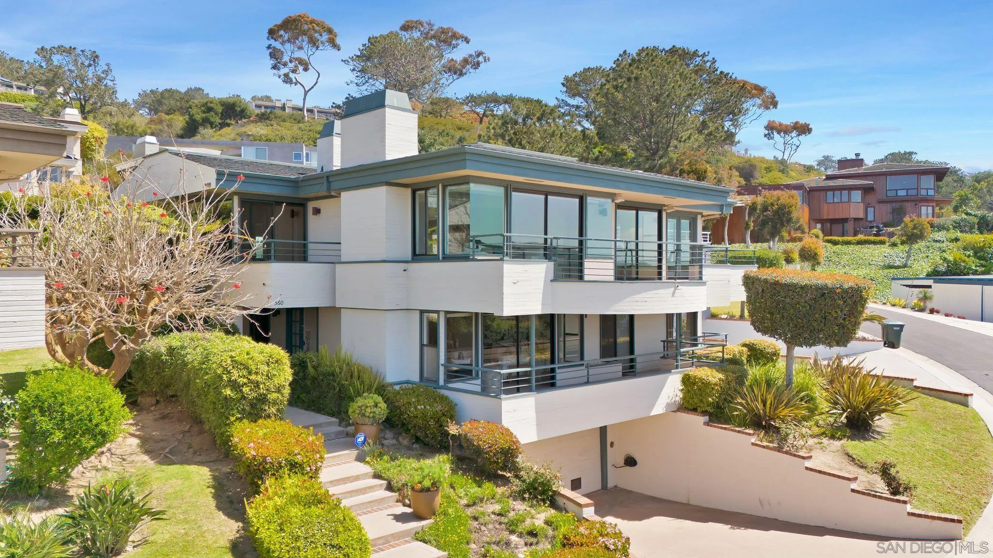 560 Torrey Point Road Del Mar, CA 92014 - Photo 4 of 35 a front view of a house with a garden