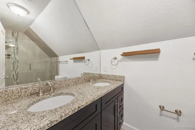 a bathroom with a shower and a toilet