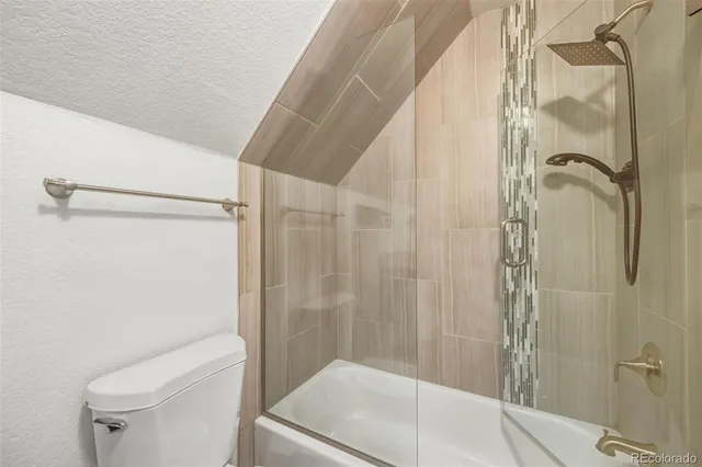 a front view of a house with a floor to ceiling windows