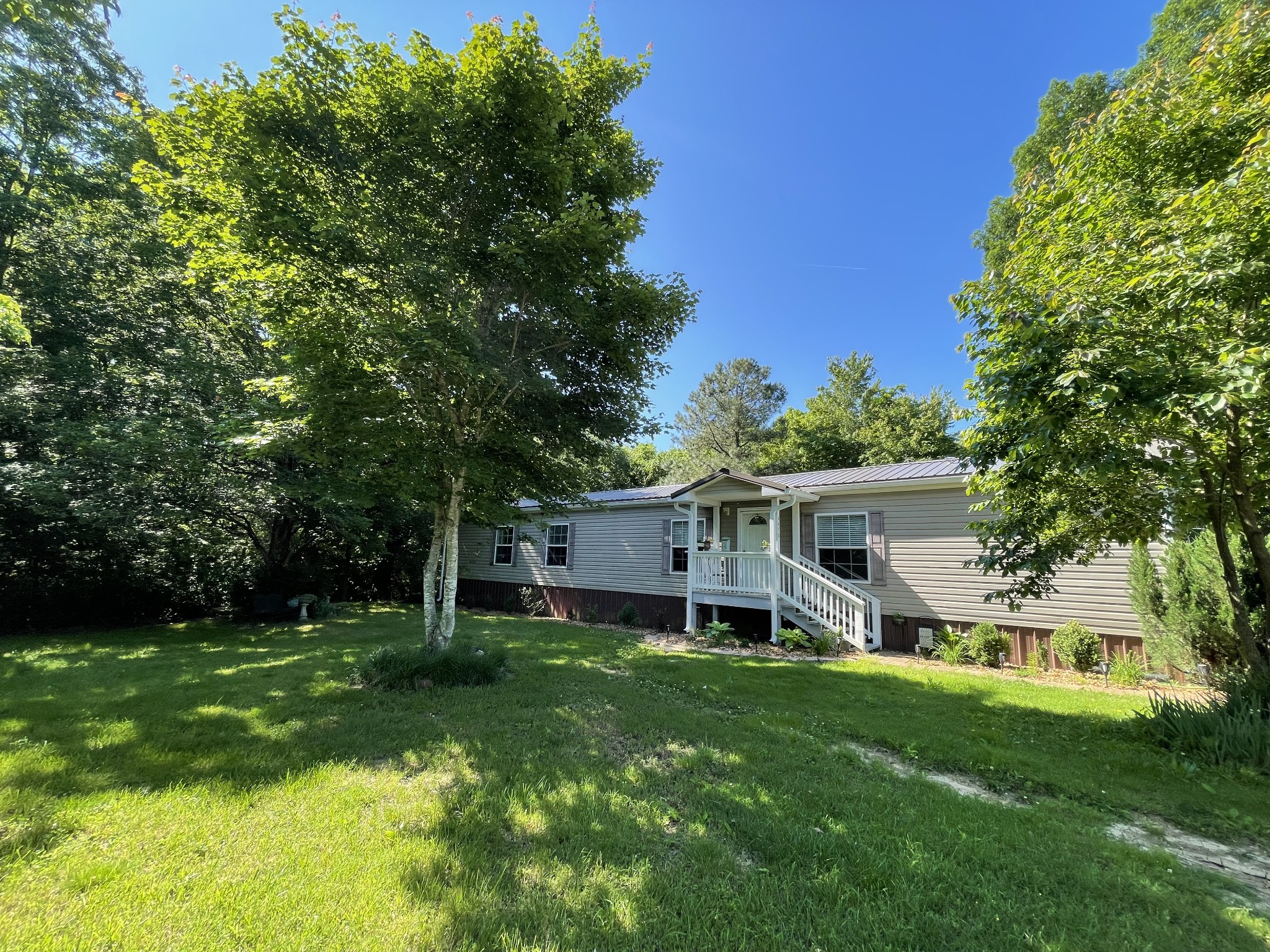 4470 St Paul Road Woodlawn, TN 37191 - Photo 2 of 9 front view of a house with a yard