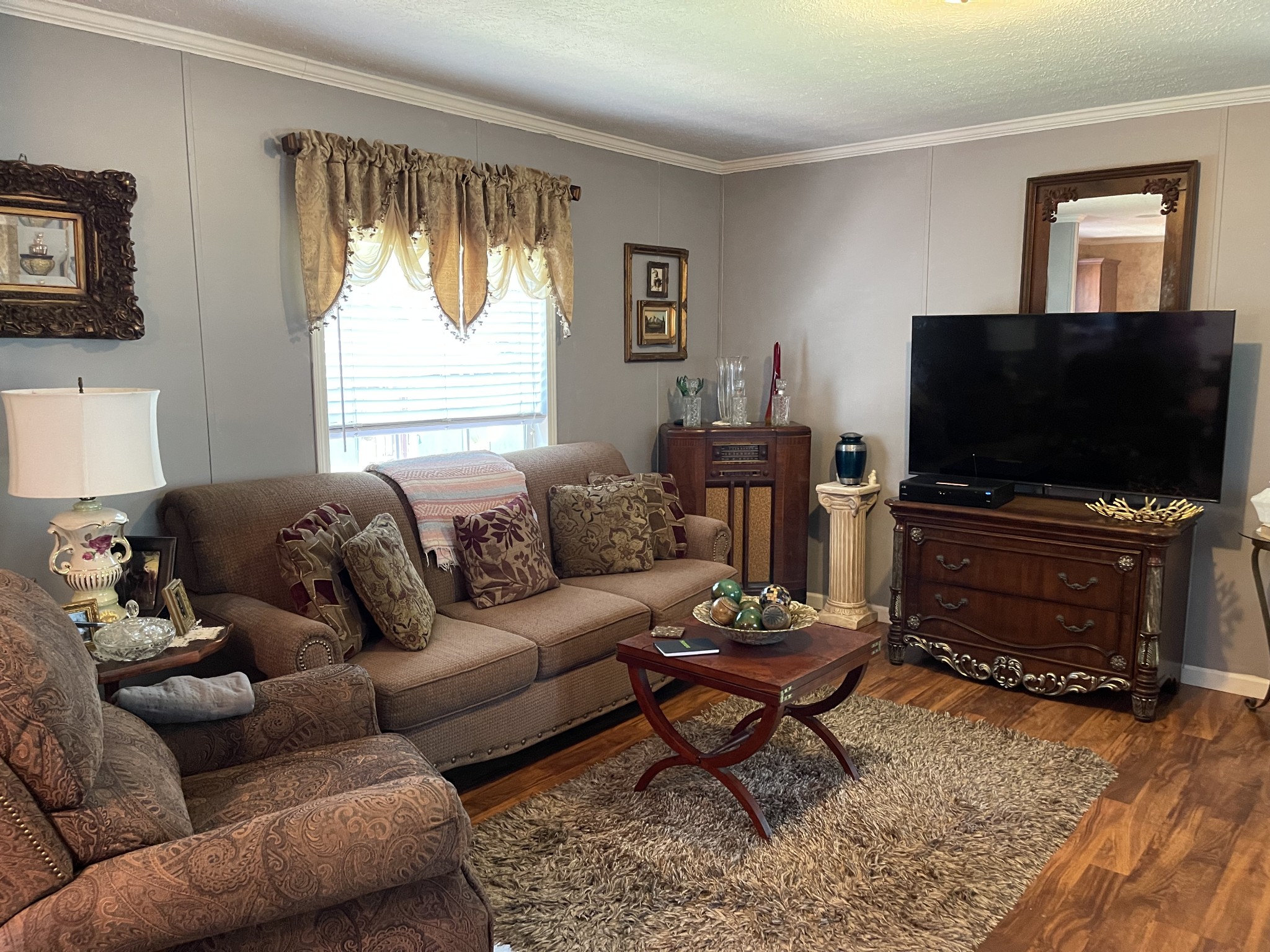 4470 St Paul Road Woodlawn, TN 37191 - Photo 8 of 9 a living room with furniture and a flat screen tv