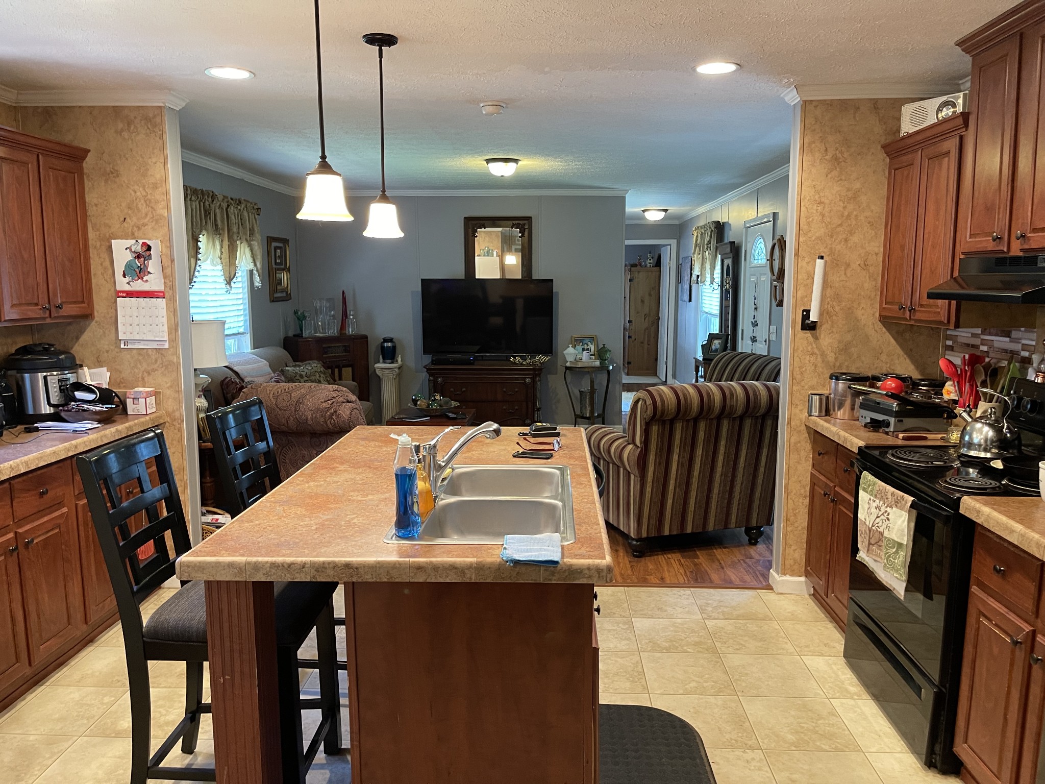 4470 St Paul Road Woodlawn, TN 37191 - Photo 9 of 9 a kitchen with a table chairs refrigerator and microwave