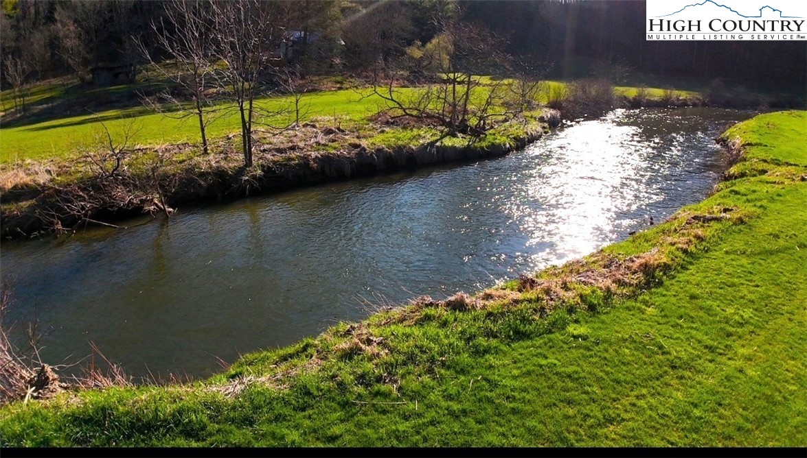 11644 Highway 88 Creston, NC 28615 - Photo 12 of 50 a view of swimming pool from a lake