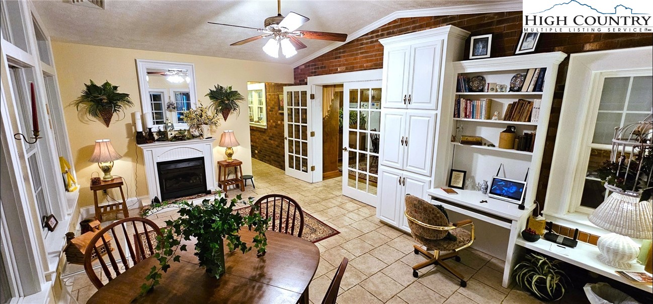 11644 Highway 88 Creston, NC 28615 - Photo 22 of 50 a view of a livingroom with furniture a flat screen tv and a stove