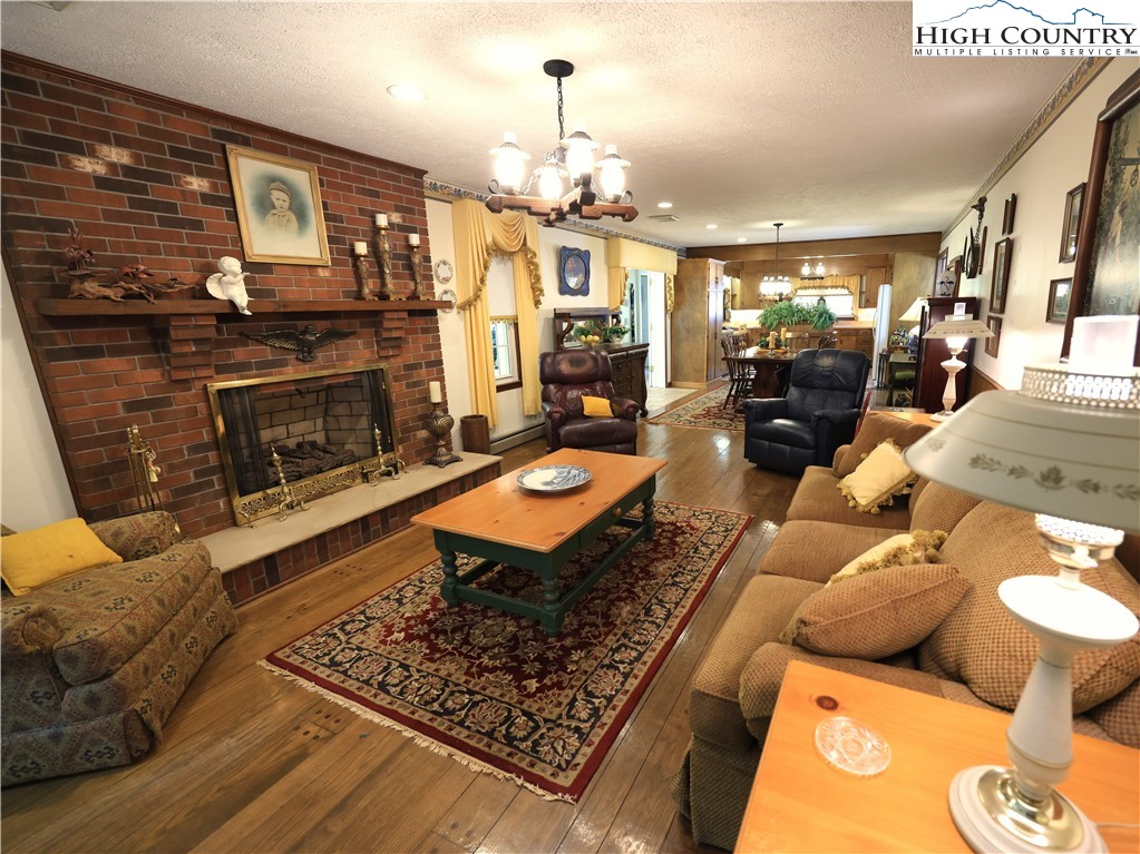 11644 Highway 88 Creston, NC 28615 - Photo 24 of 50 a living room with furniture and a fireplace