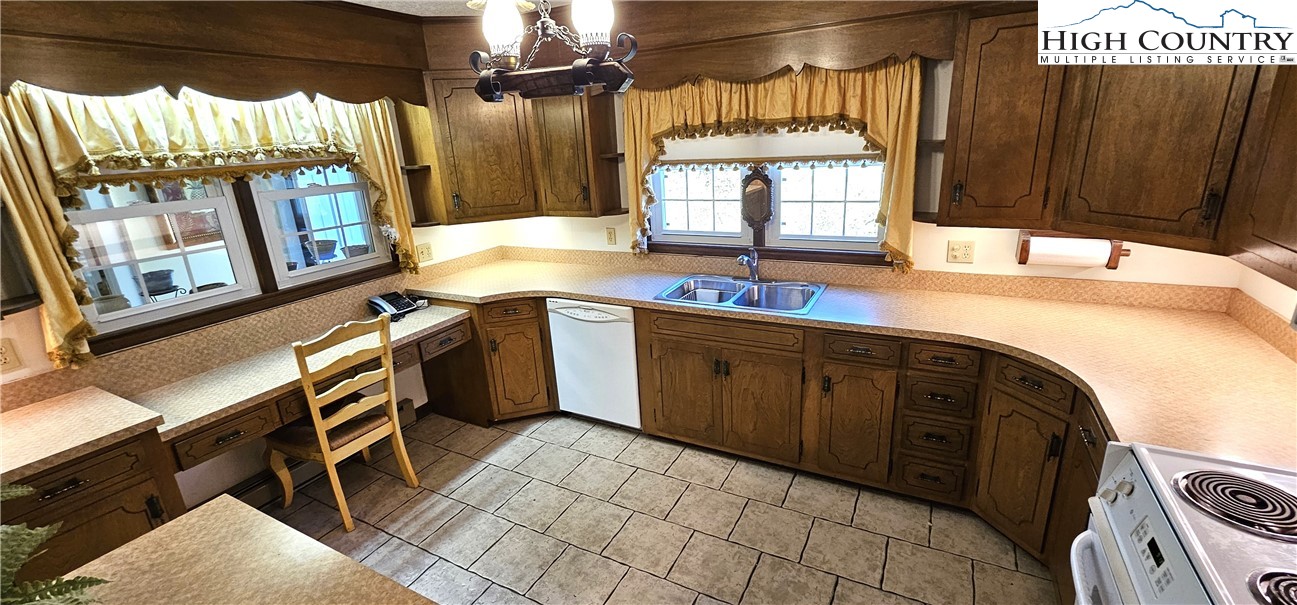 11644 Highway 88 Creston, NC 28615 - Photo 29 of 50 a kitchen with a sink and a stove