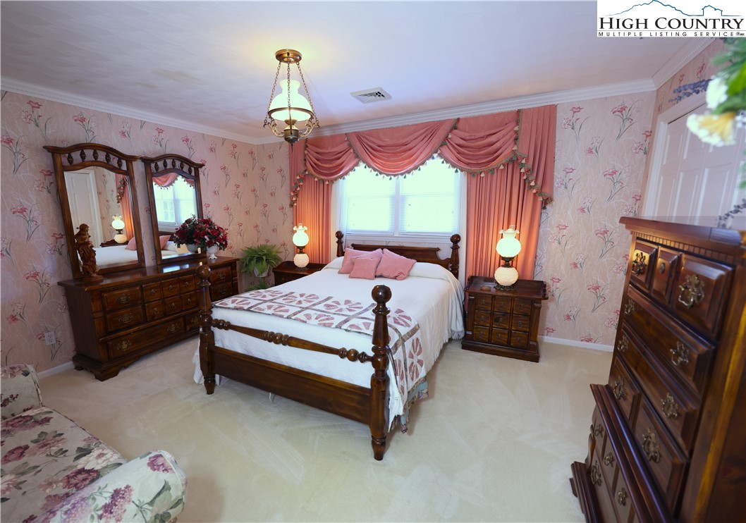 11644 Highway 88 Creston, NC 28615 - Photo 34 of 50 a bedroom with a bed dresser and a window