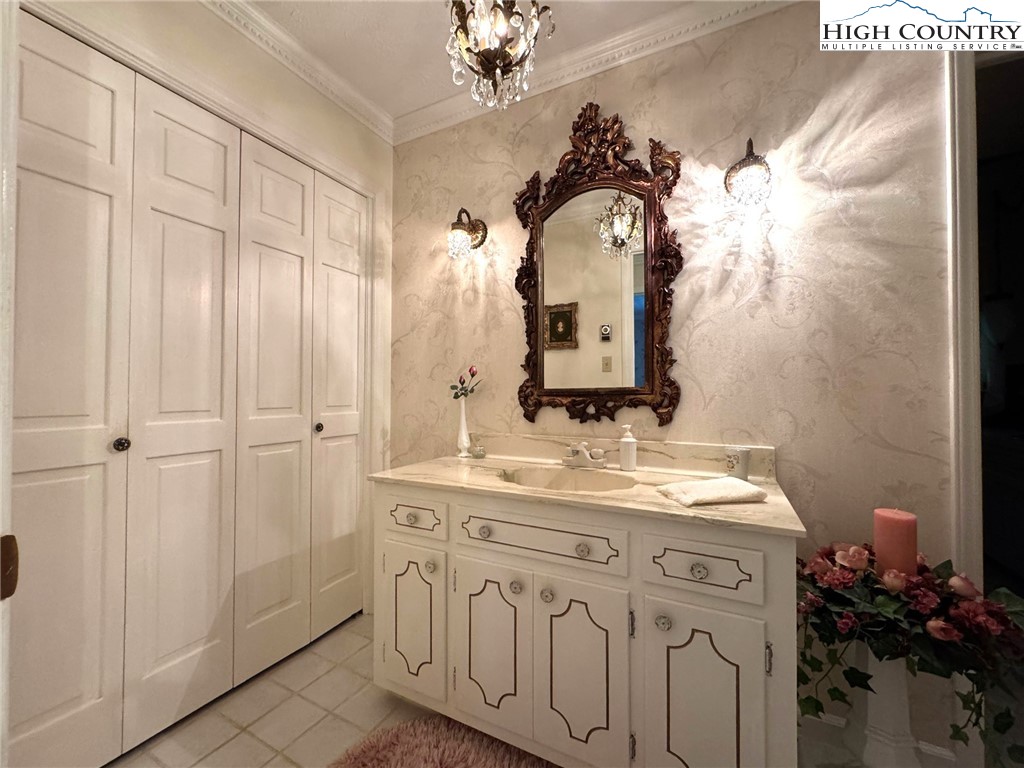11644 Highway 88 Creston, NC 28615 - Photo 35 of 50 a bathroom with a sink vanity and a mirror