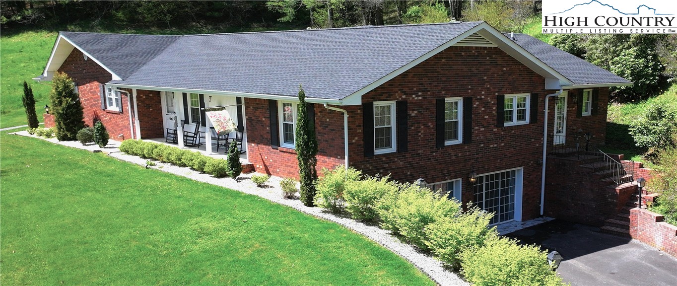 11644 Highway 88 Creston, NC 28615 - Photo 4 of 50 a front view of a house with a yard