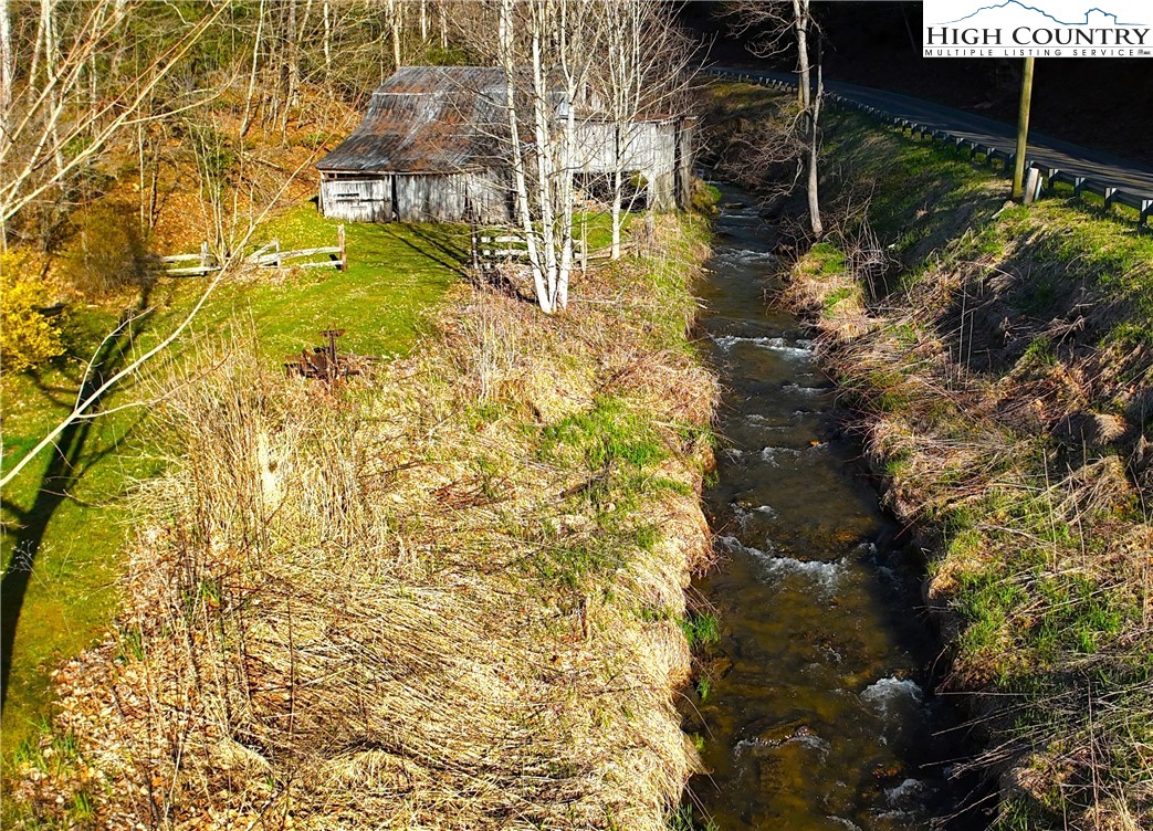 11644 Highway 88 Creston, NC 28615 - Photo 41 of 50 a view of swimming pool from a lake view