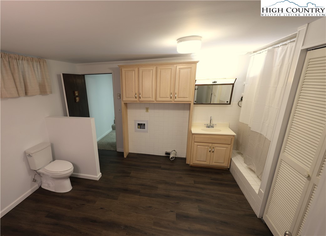 11644 Highway 88 Creston, NC 28615 - Photo 47 of 50 a bathroom with a sink toilet and tub