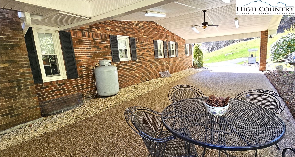 11644 Highway 88 Creston, NC 28615 - Photo 9 of 50 a bed sitting in a room next to a window