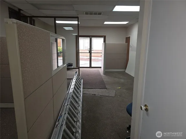 a view of hallway with windows