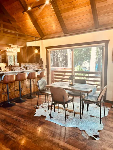 a living room with lots of furniture and a large window