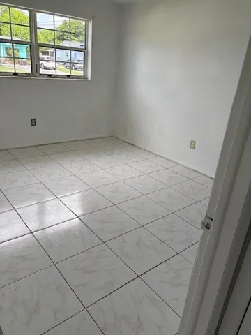 a view of an empty room and window