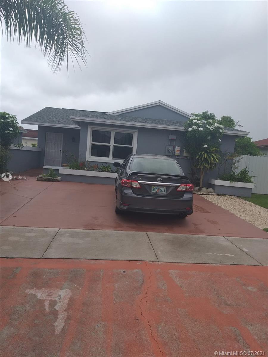 a car parked in front of a house