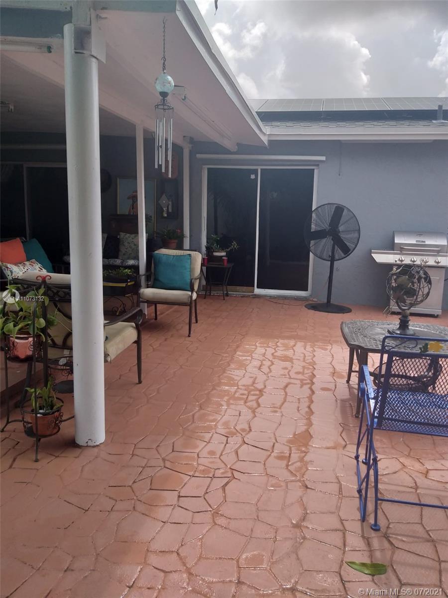 12374 Southwest 197th Terrace Miami, FL 33177 - Photo 3 of 13 a outdoor space with lots of table and chairs