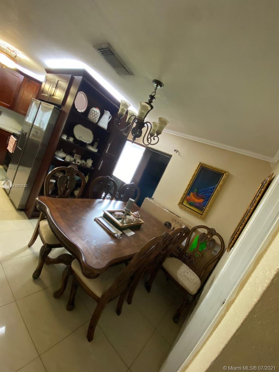 12374 Southwest 197th Terrace Miami, FL 33177 - Photo 9 of 13 a view of a workspace with furniture