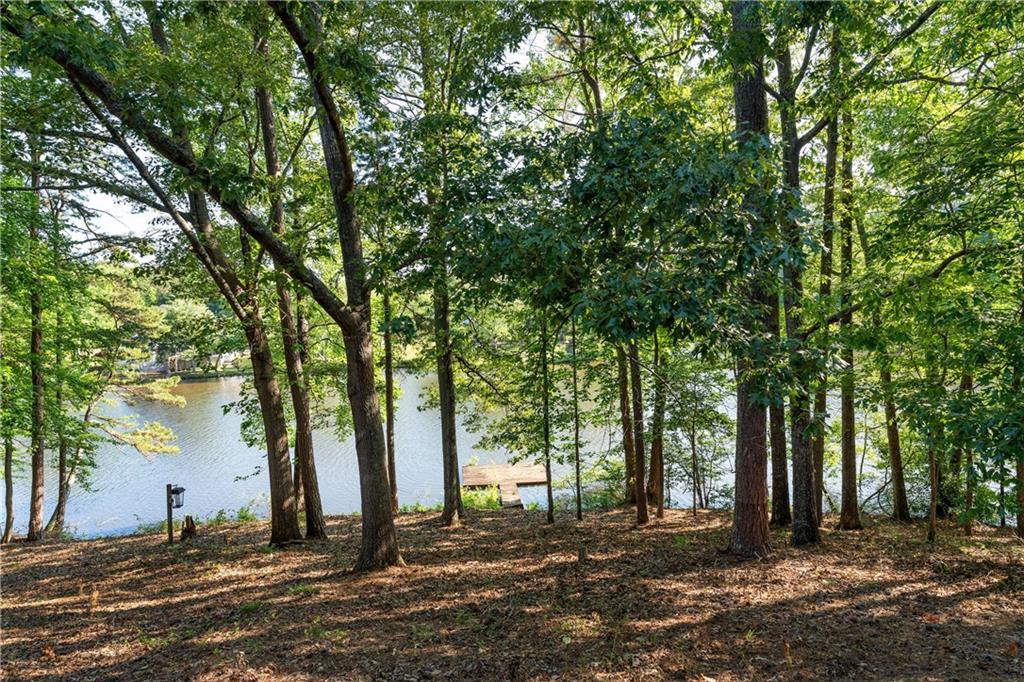 24 Commerce Row Northeast Cartersville, GA 30121 - Photo 35 of 37 a backyard of a house with lots of green space