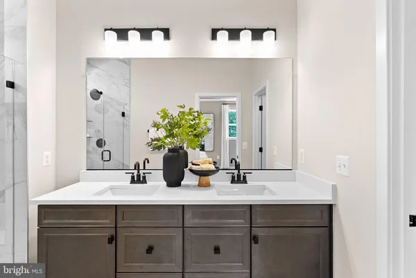a bathroom with mirror sink and vanity