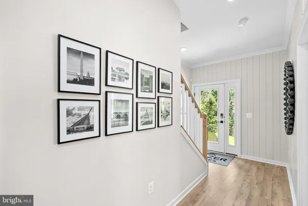 a view of an entryway with wooden floor