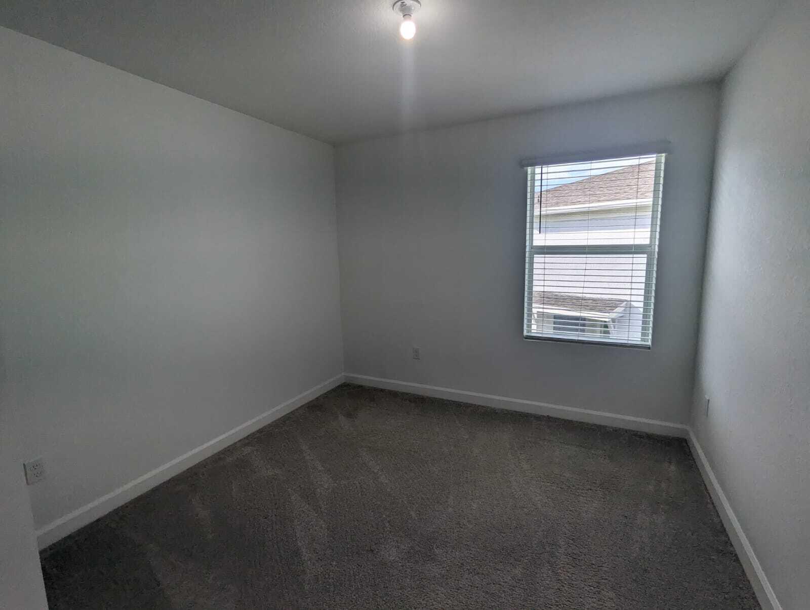 4351 Pond Lily Lane Lake Worth, FL 33467 - Photo 11 of 26 an empty room with a window