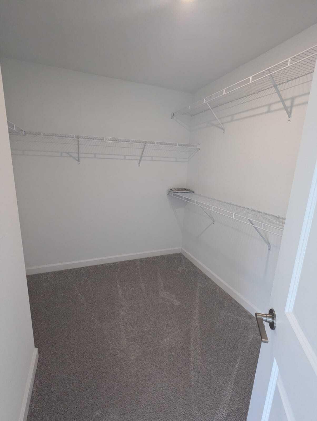 4351 Pond Lily Lane Lake Worth, FL 33467 - Photo 12 of 26 a view of a room with racks on the wall