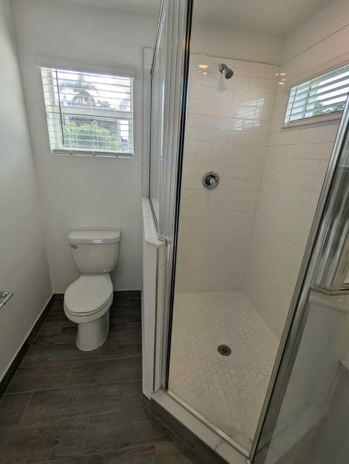 4351 Pond Lily Lane Lake Worth, FL 33467 - Photo 13 of 26 a bathroom with a toilet and a shower