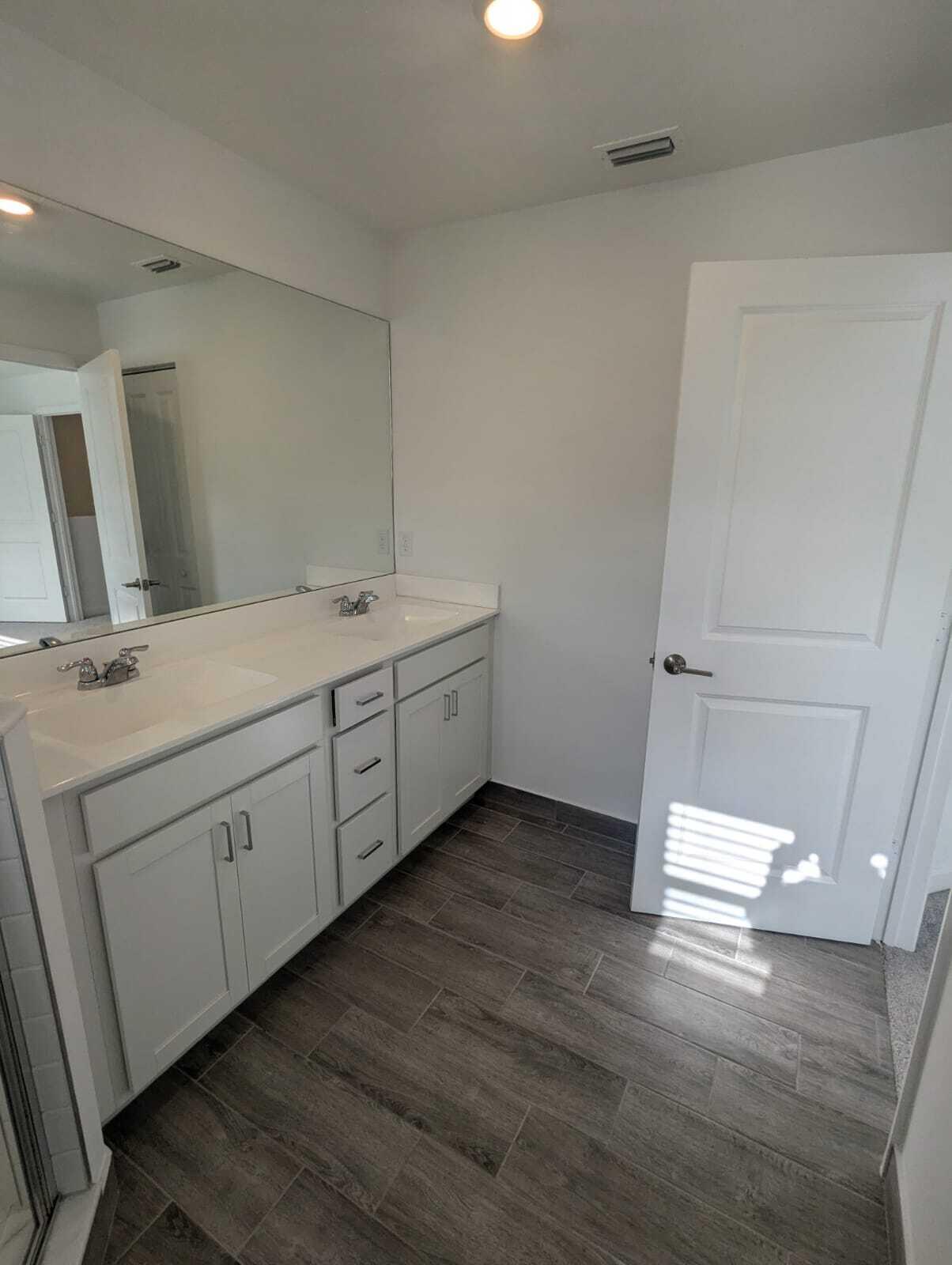 4351 Pond Lily Lane Lake Worth, FL 33467 - Photo 14 of 26 a room with a sink and mirror