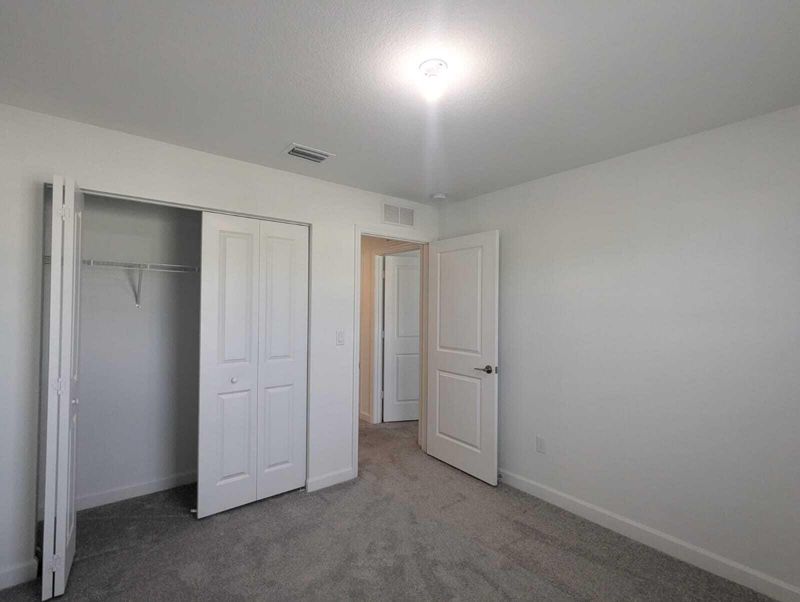 4351 Pond Lily Lane Lake Worth, FL 33467 - Photo 23 of 26 an empty room with closet area