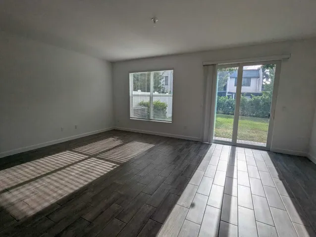 a view of wooden floor in an empty room
