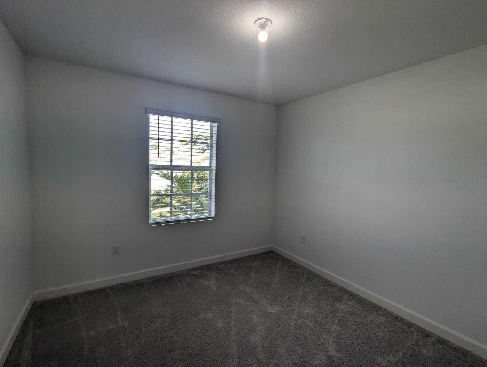 4351 Pond Lily Lane Lake Worth, FL 33467 - Photo 6 of 26 an empty room with a window