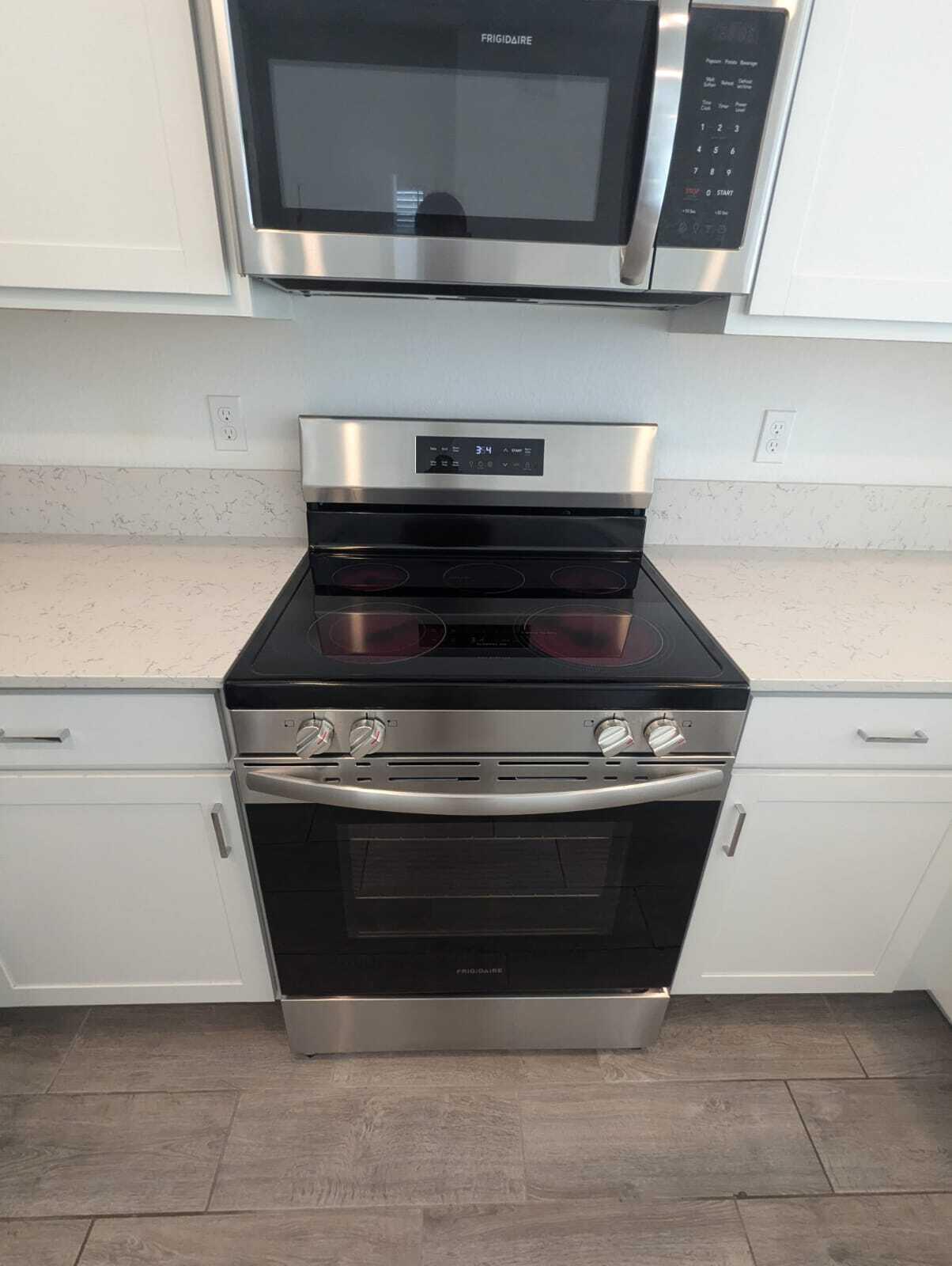 4351 Pond Lily Lane Lake Worth, FL 33467 - Photo 7 of 26 a stove top oven sitting inside of a kitchen