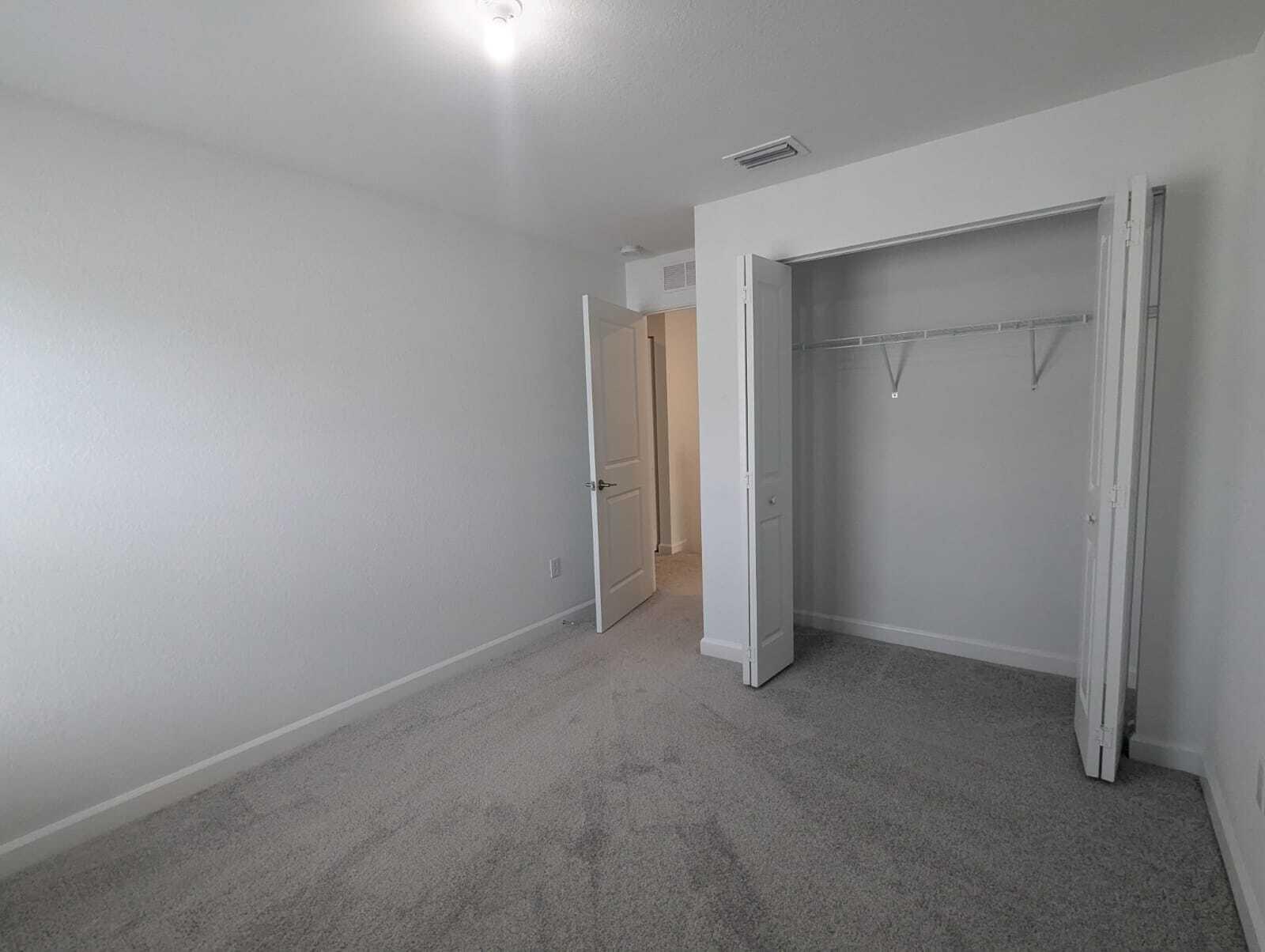 4351 Pond Lily Lane Lake Worth, FL 33467 - Photo 9 of 26 an empty room that has a grey walls