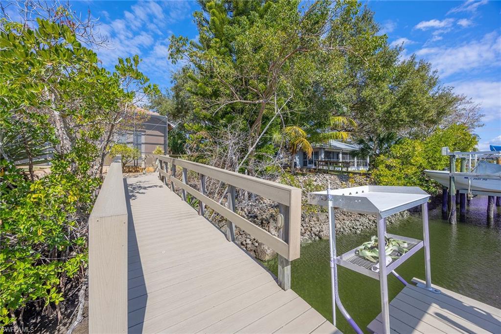 146 Windward Cay Naples, FL 34114 - Photo 27 of 33 a balcony with chairs