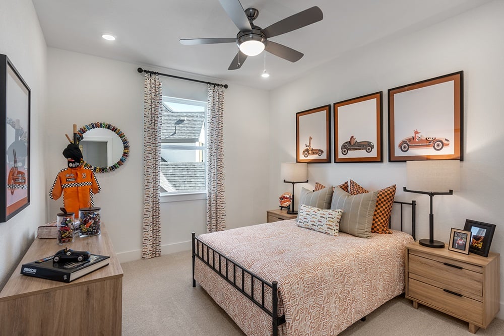 1804 Plum Tree Way Georgetown, TX 78628 - Photo 18 of 30 a bedroom with a bed and a chandelier