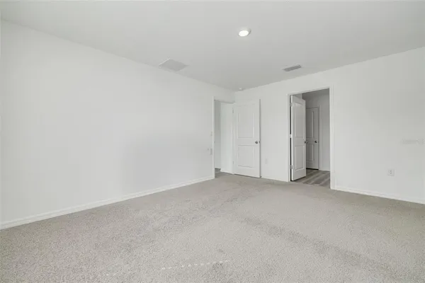 an empty room with closet area