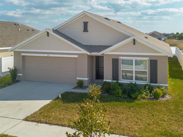 an aerial view of residential houses with city view