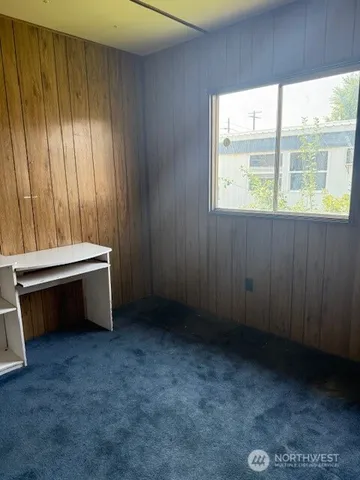 a room with a bed and a window