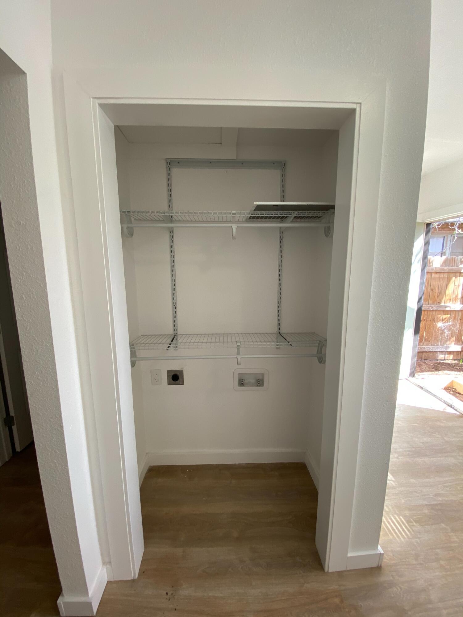 2017 17th Street, Unit REAR Lubbock, TX 79401 - Photo 5 of 9 a view of walk in closet with empty racks