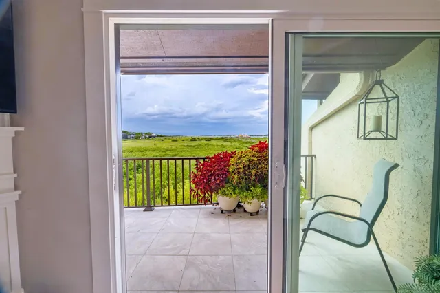 a bedroom with a bed and a potted plant