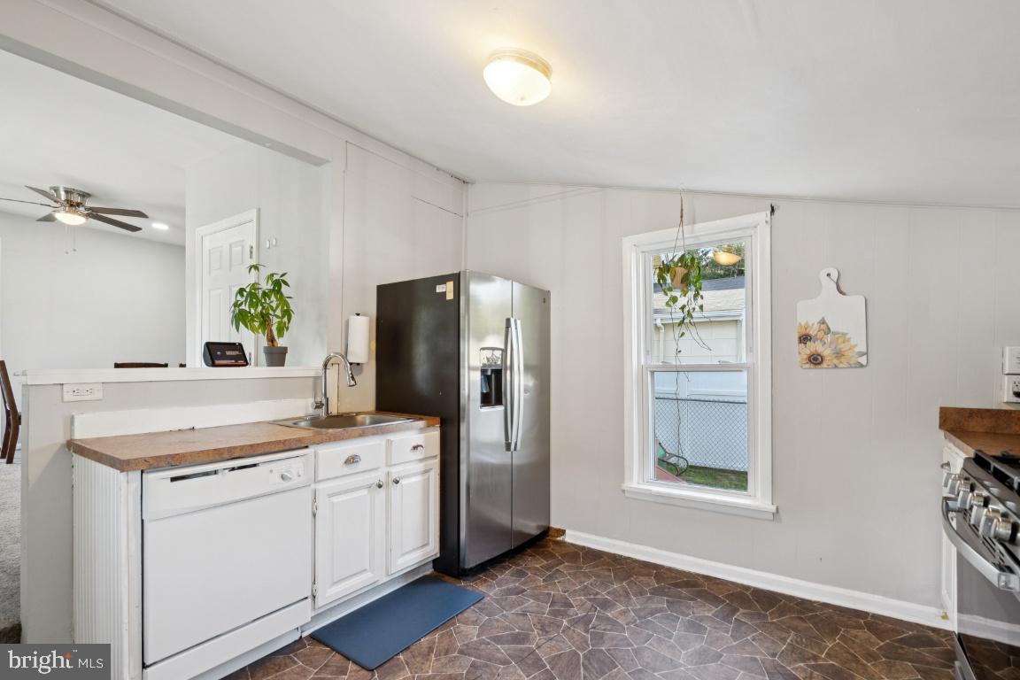 344 Raritan Avenue Atco, NJ 08004 - Photo 16 of 26 a kitchen with a refrigerator and a stove top oven