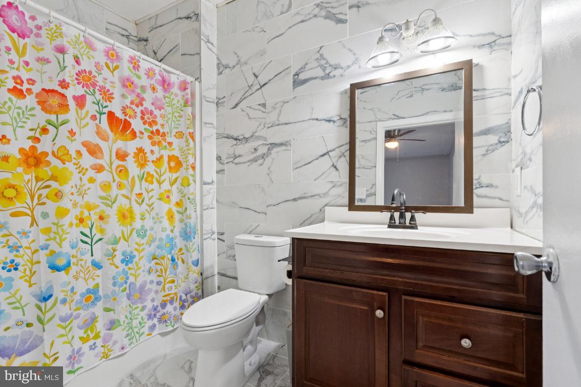 344 Raritan Avenue Atco, NJ 08004 - Photo 18 of 26 a bathroom with a sink a toilet and a mirror