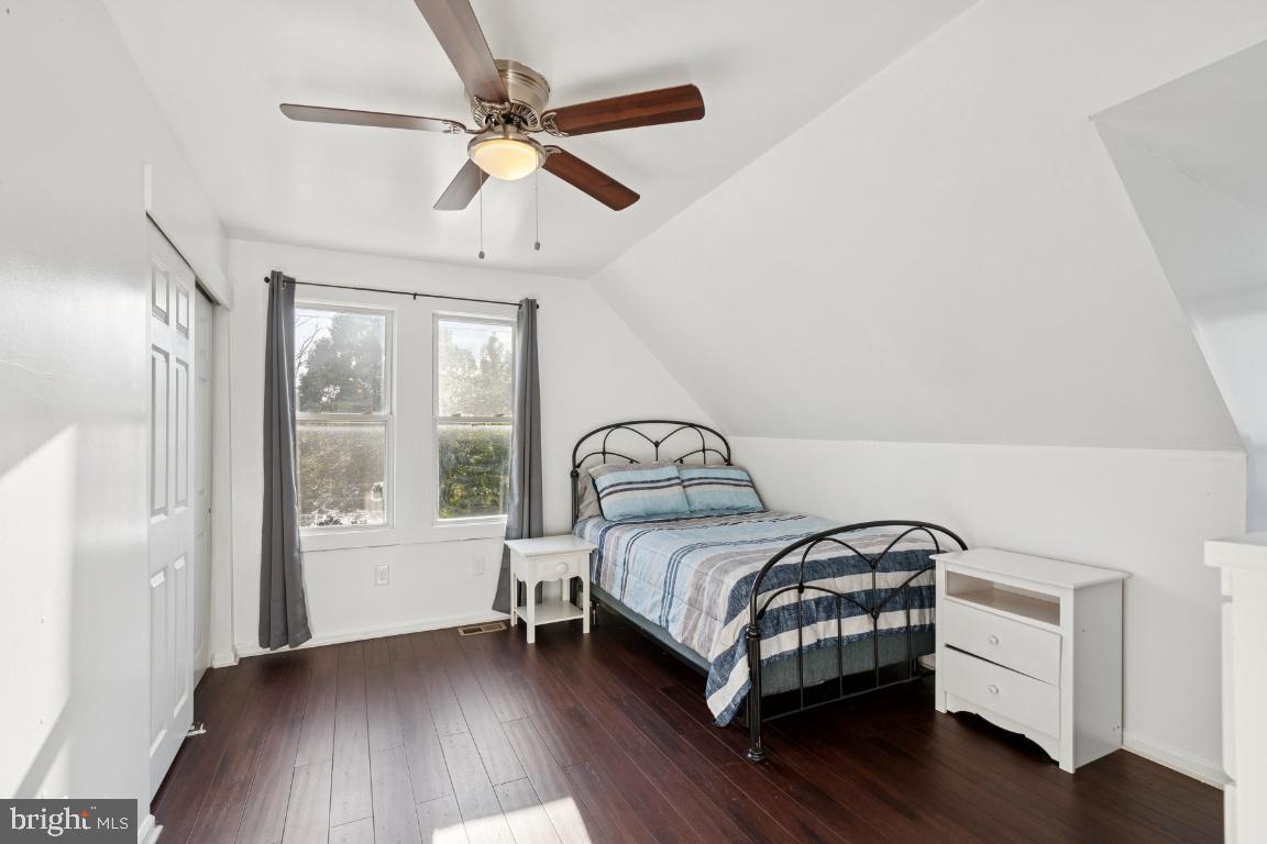 344 Raritan Avenue Atco, NJ 08004 - Photo 21 of 26 a bedroom with a bed and a large window with wooden floor