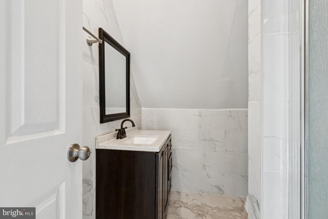 344 Raritan Avenue Atco, NJ 08004 - Photo 23 of 26 a bathroom with a sink and mirror