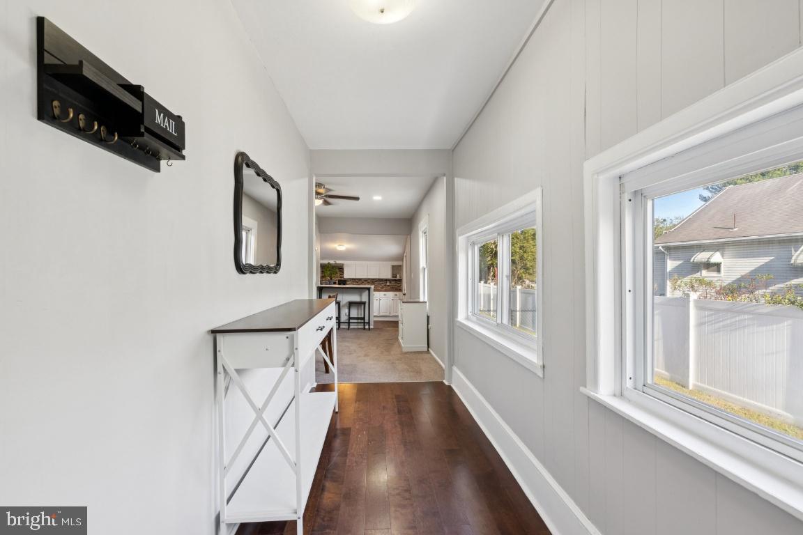 344 Raritan Avenue Atco, NJ 08004 - Photo 10 of 26 a view of a hallway with furniture and a window