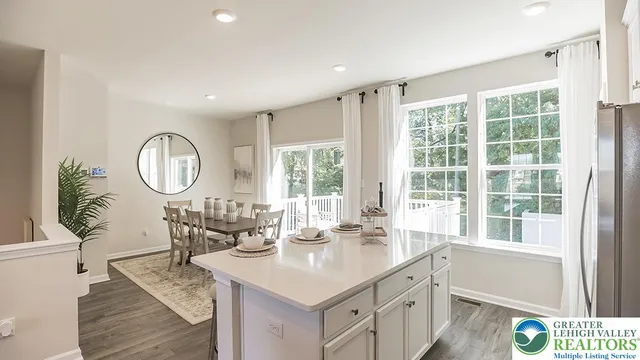 a view of a kitchen with a window and a view of living room