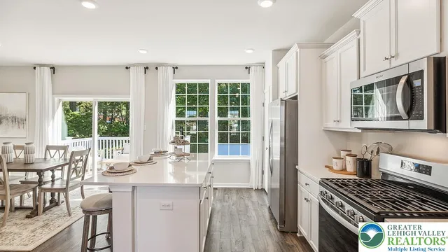 a kitchen with granite countertop a stove and a sink