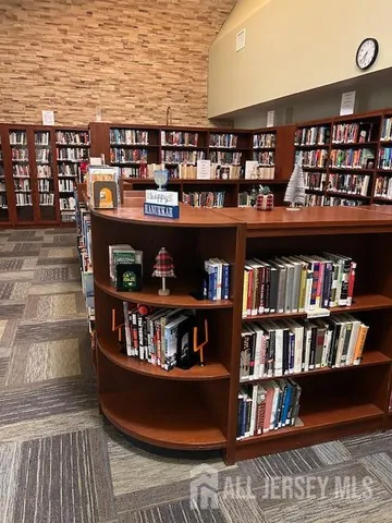 a view of a living room with clothes and shoes